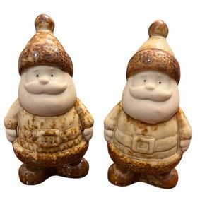 Two Brownware Primitive Santa Claus Ceramic Figures